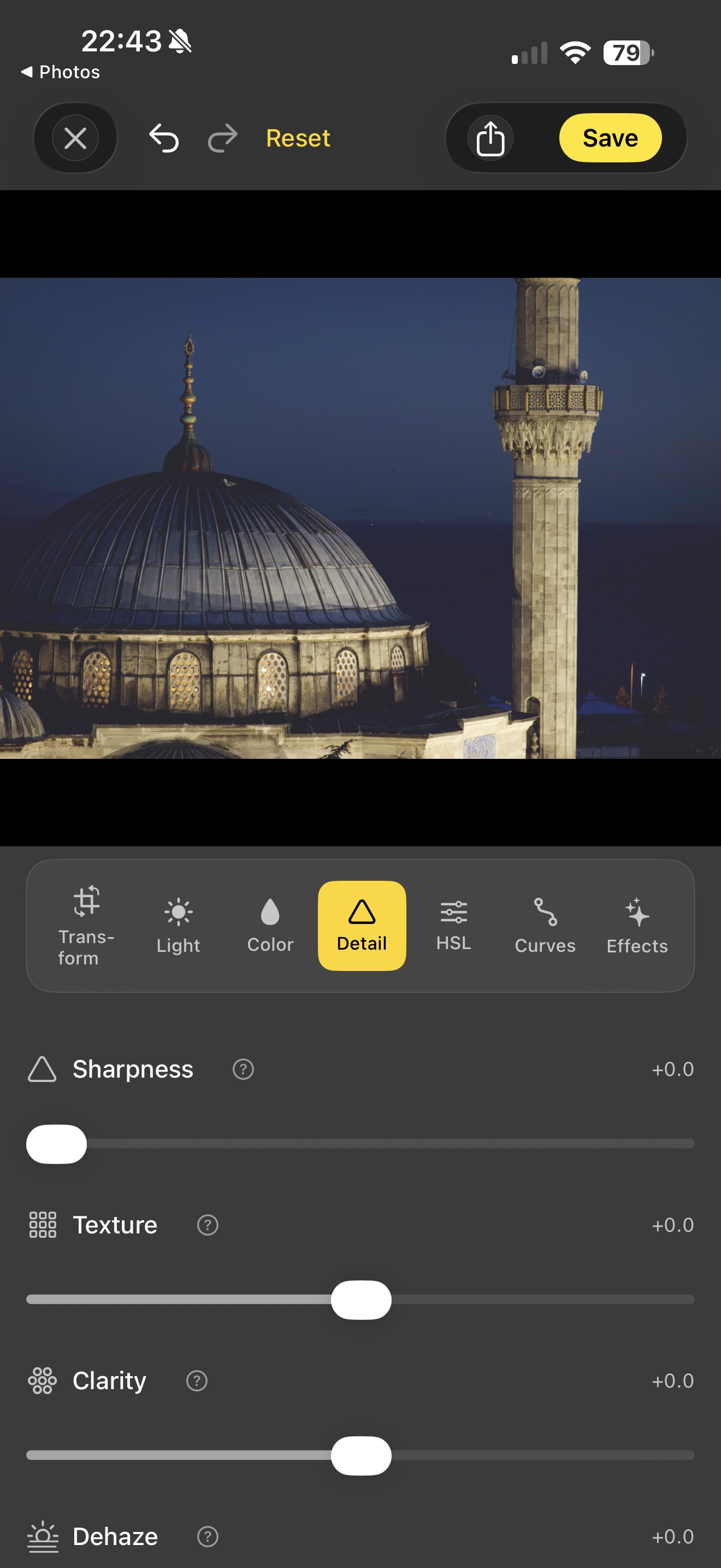 Acetate editor's Detail tab over a low-light photo of the Blue Mosque dome and a minaret at dusk, showing Sharpness, Texture, Clarity, and Dehaze sliders all at zero ready to be dialled in