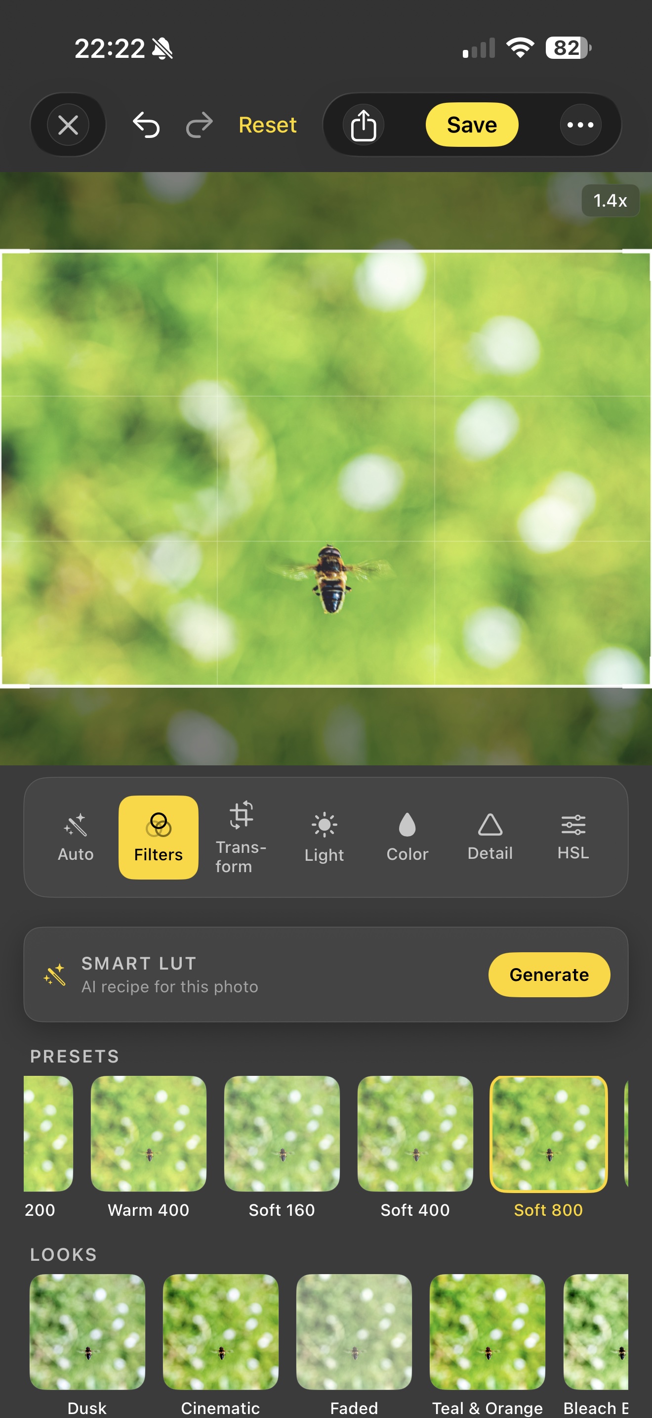 Acetate editor's Filters tab over a macro shot of a hoverfly on a green bokeh background, showing the Smart LUT card, a PRESETS row of film-stock LUTs (200, Warm 400, Soft 160, Soft 400, Soft 800 selected), and a LOOKS row underneath (Dusk, Cinematic, Faded, Teal & Orange, Bleach Bypass)